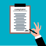 Image of a clipboard with the word “complaint,” representing the need for California CRD complaint defense.